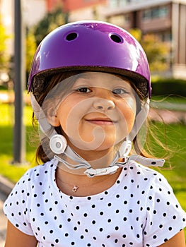 Little girl on roller skates in helmet