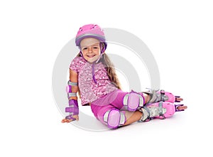 Little girl with roller skates resting