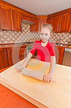 Little girl with rolling pin