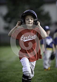 Little girl running the bases