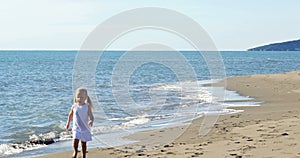 Little girl running on the beach
