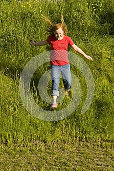 Little girl is running of a hill