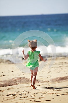 Little girl running on Lanzarote beach