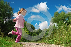 Little girl runs across path outdoor