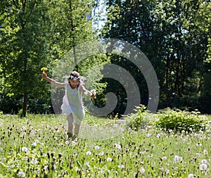 a little girl runs through the forest