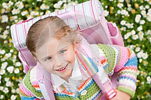 Little girl rushing to school photo