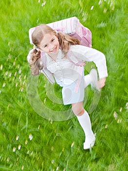 Little girl rushing to school