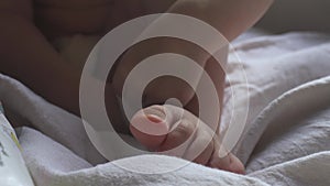 Little girl's foot, wiggling her toes.