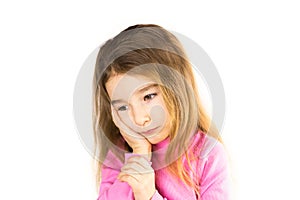 Little girl with sad face holds her cheek with hand - tooth hurts. Ear pain, toothache, swollen cheek and gums, problems of