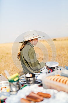 Little girl on safari bush breakfast