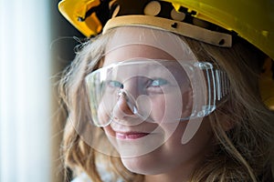 Little girl with safety helmet and goggles