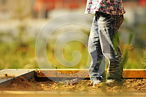 Little girl in a sandbox