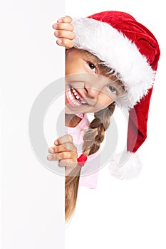 Little girl in Santa hat