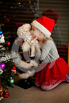 Little girl and Santa toy