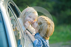 Little girl says goodbye to little boyfriend who sails for long time. Farewell child concept. Little boy say good bye