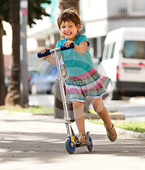 Little girl with scooter