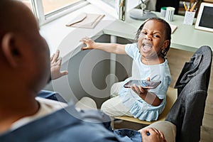 Little girl screaming at father