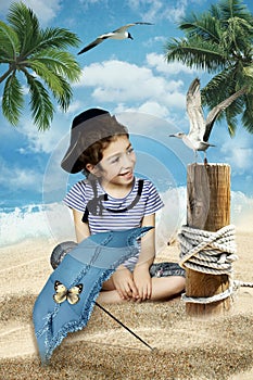 Little girl on the sea beach and a seagull