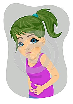 Little girl with severe stomach ache or nausea making sad face photo