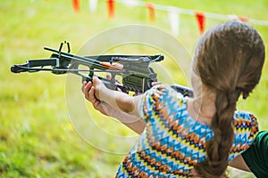 Little girl shooting crossbow