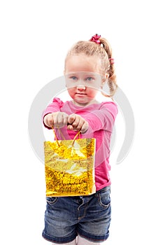 Little girl with shopping bag isolated on white