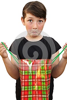 Little girl with shopping bags on white background