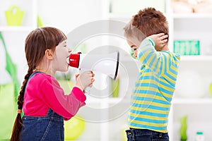 Little girl shouting loud to boy