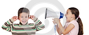 Little girl shouting through megaphone at a boy