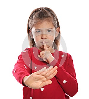 Little girl showing HUSH gesture in sign language on white