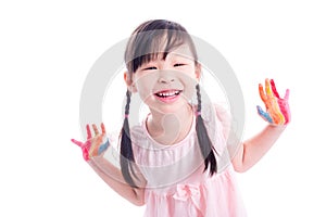 Little girl showing painted hand over white backgrou photo