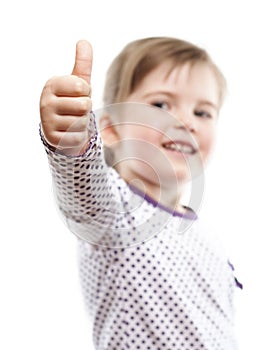 Little girl showing thumb up