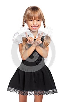 Little girl showing victory sign