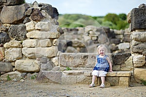 Little girl sightseeing historical ruins