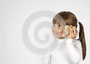 Little girl simulate phone calling photo
