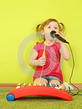 Little girl singing into a