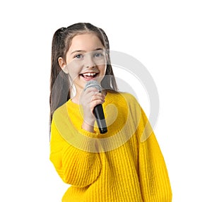 Little girl singing into microphone on white