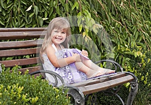 Little girl siting in the park
