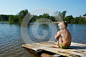 Little girl sits on a raft