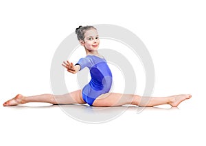 Little girl sits on a splits