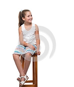 Little girl sitting on the chair