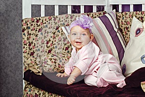 Little girl sitting on couch