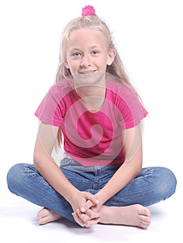 Little girl sitting cross-legged