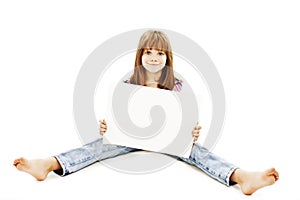 Little girl sitting on floor showing advert