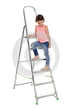 Little girl sitting on ladder on white background
