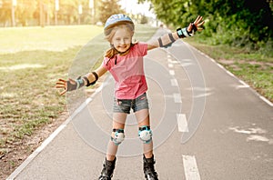 Little girl skating on roller blades