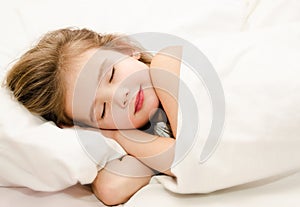 Little girl sleep in the bed