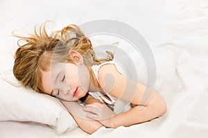 Little girl sleep in the bed