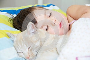 Little girl sleep with cat, favorite pet lying on child chest, Interactions between children and Cat
