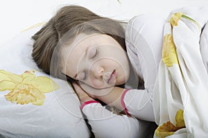 Little girl sleeping in bed