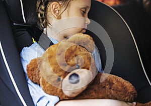 Little girl sleeping in the car